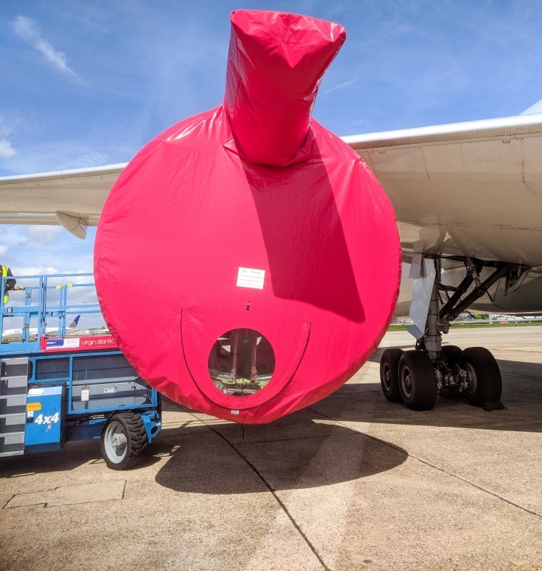 Red Engine Intake Cover on Plane